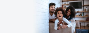 Family having fun inside their home protected by homeowners insurance