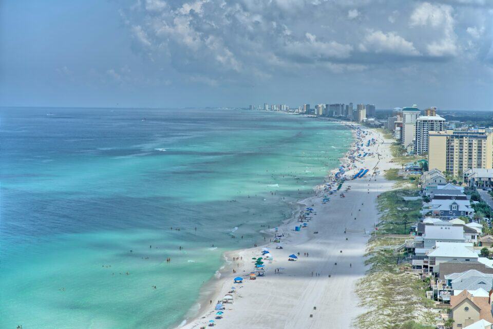 Aerial view of a Florida Atlantic shoreline with turquoise surf and beachfront condominiums
