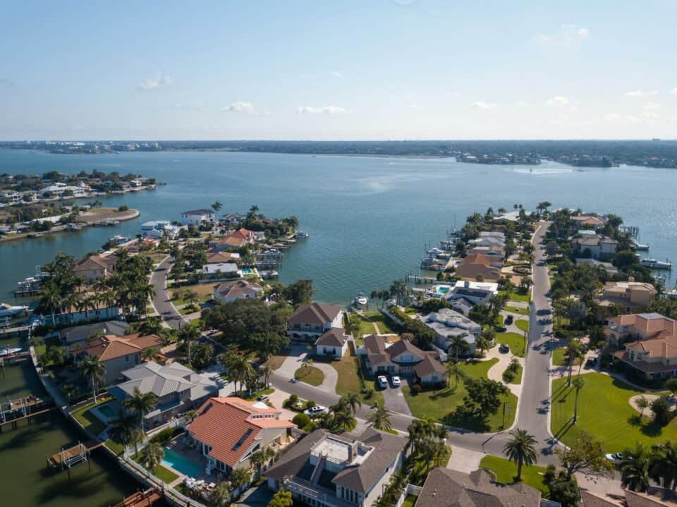 Aerial view of a Florida waterfront residential neighborhood along an inlet