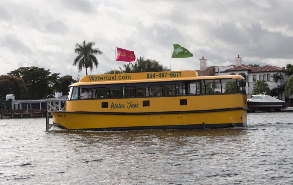 A water taxi cruising the yacht-lined canals of Fort Lauderdale, Florida