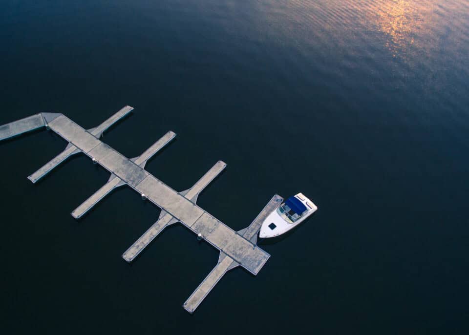Aerial view of a boat docked at a pier on Lake Dora in Mount Dora, Florida