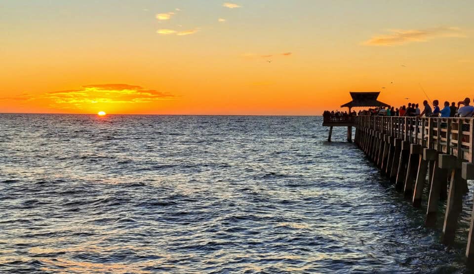 Naples Pier at sunset over the Gulf of Mexico in Naples, Collier County, Florida