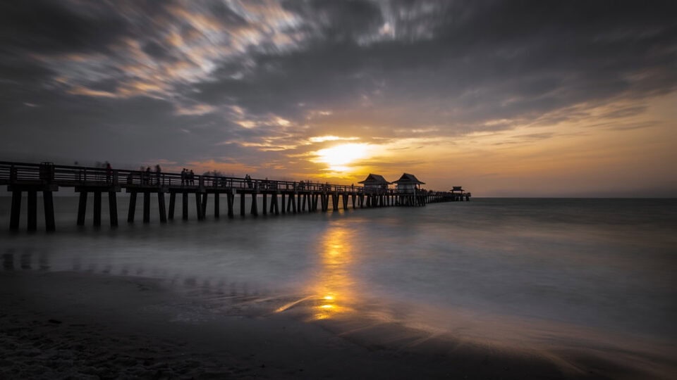 Naples Municipal Beach and Fishing Pier at sunset in Collier County, Southwest Florida