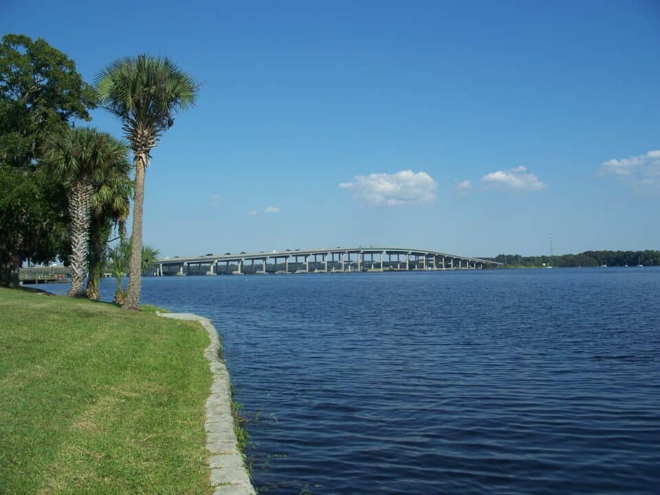 Memorial Bridge over the St. Johns River framed by palm trees at the downtown riverfront in Palatka, Putnam County, Florida