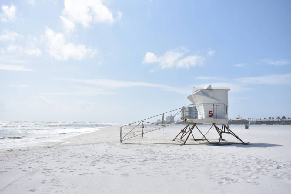 A lifeguard tower on the white sand of Pensacola Beach, Florida