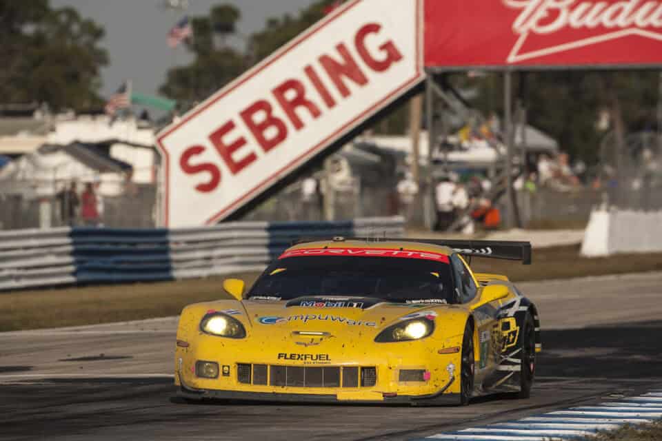 A race car passing under the Sebring banner at Sebring International Raceway in Sebring, Florida