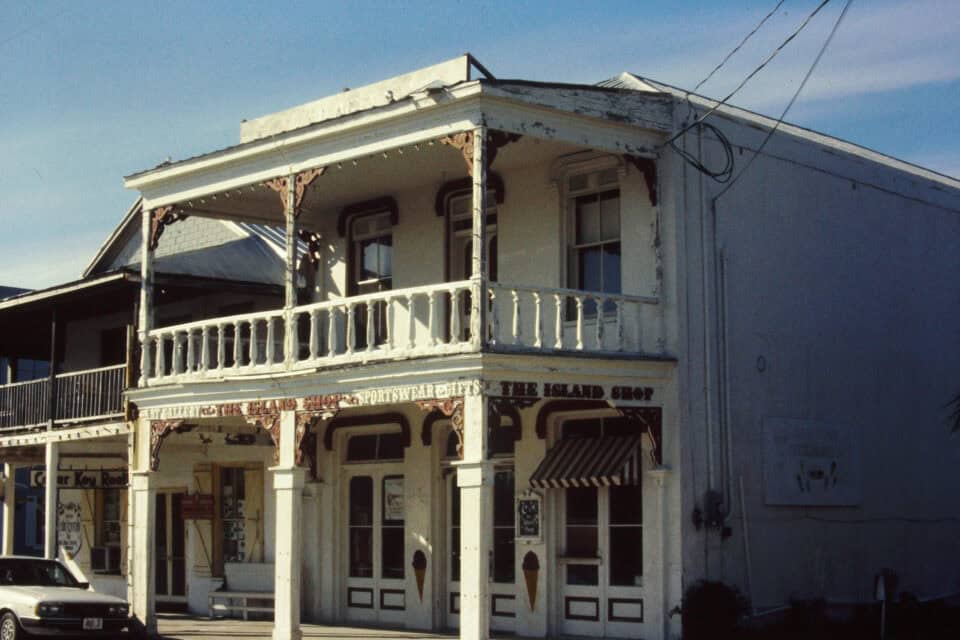A historic two-story storefront with balcony on Second Street in Cedar Key, Florida